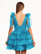 KissProm Trendy  A-Line Royal Blue Tiered Homecoming Dress with Bow | Crafted from durable polyester, the V-neckline frames your face beautifully. Shine bright on your special night in this comfortable and luxurious dress.